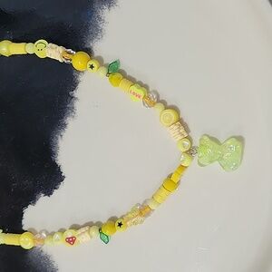 One of a kind yellow charm necklace